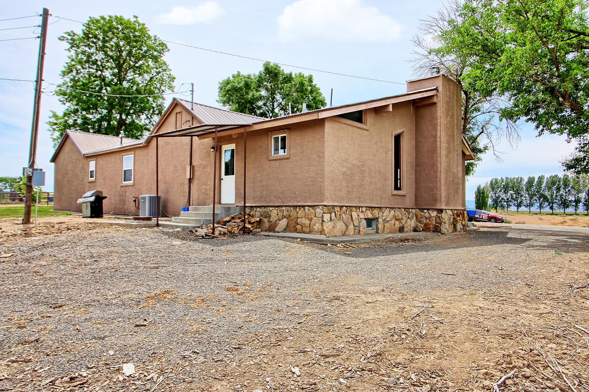 990 T Road Mack, CO 81525 - Photo 39 of 42 a view of a house with backyard and sitting area