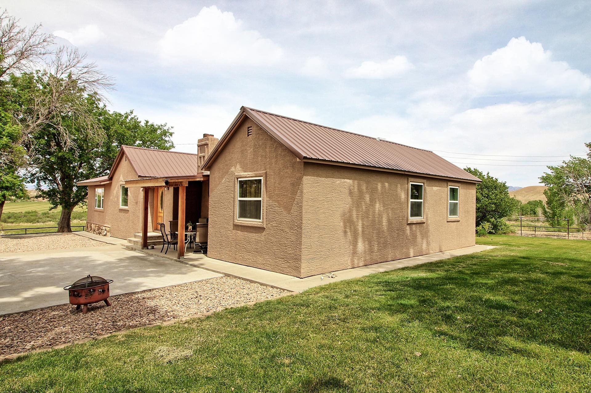 990 T Road Mack, CO 81525 - Photo 40 of 42 a view of a house with a yard