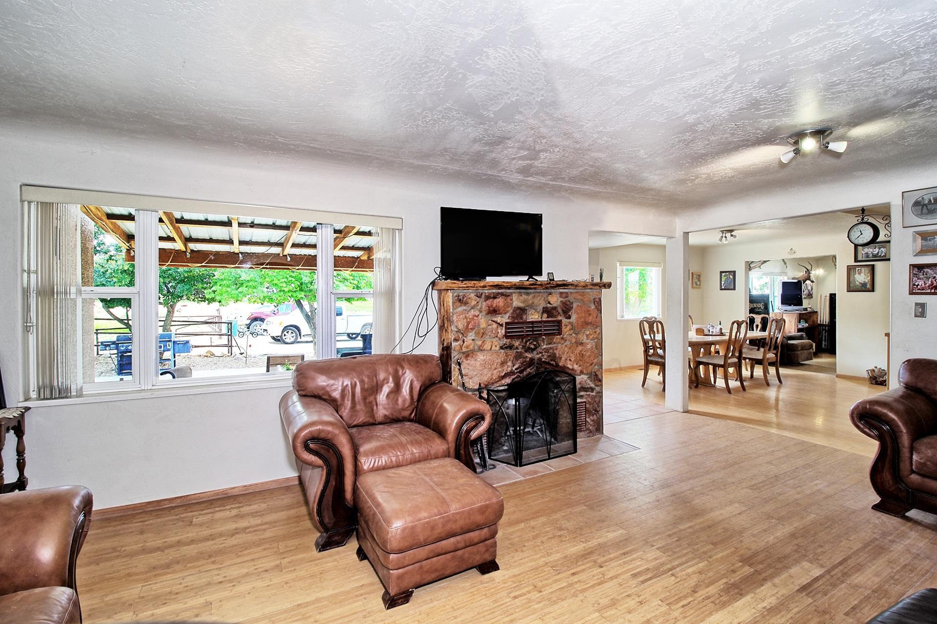 990 T Road Mack, CO 81525 - Photo 4 of 42 a living room with furniture and a flat screen tv