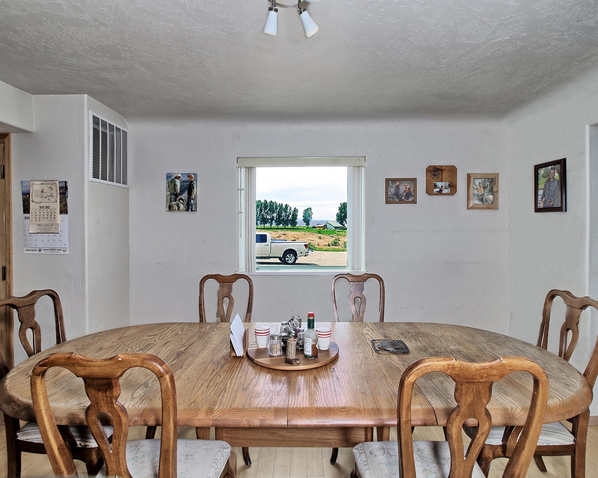 990 T Road Mack, CO 81525 - Photo 9 of 42 a view of a dining room with furniture and a window