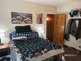 202 Berlin Avenue Southington, CT 06489 - Photo 13 of 26 a bed sitting in a bedroom next to a window