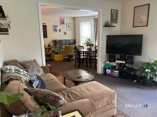 202 Berlin Avenue Southington, CT 06489 - Photo 18 of 26 a living room with furniture and a flat screen tv