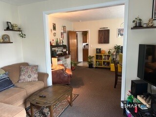 202 Berlin Avenue Southington, CT 06489 - Photo 19 of 26 a living room with furniture and a flat screen tv