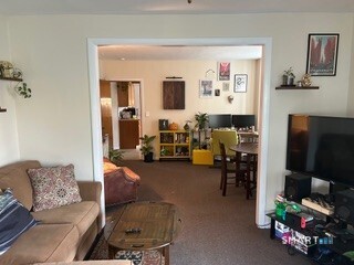 202 Berlin Avenue Southington, CT 06489 - Photo 20 of 26 a living room with furniture and a flat screen tv
