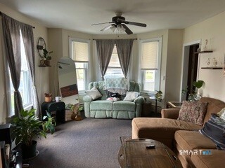 202 Berlin Avenue Southington, CT 06489 - Photo 22 of 26 a living room with furniture and a flat screen tv