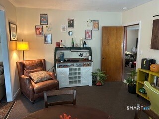 202 Berlin Avenue Southington, CT 06489 - Photo 26 of 26 a living room with furniture and a flat screen tv