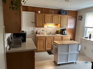 202 Berlin Avenue Southington, CT 06489 - Photo 4 of 26 a kitchen with a sink a stove and refrigerator
