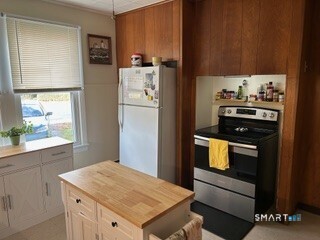 202 Berlin Avenue Southington, CT 06489 - Photo 5 of 26 a kitchen with a refrigerator and a stove top oven