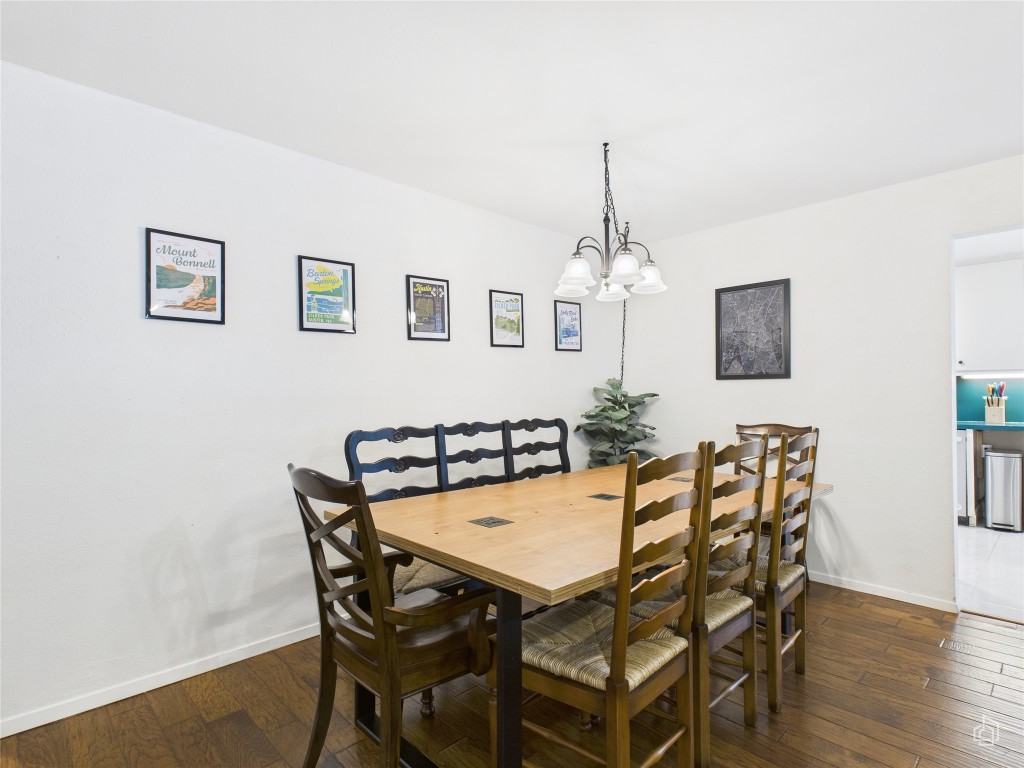 1404 Lance Way Austin, TX 78758 - Photo 13 of 29 a view of a dining room with furniture and wooden floor
