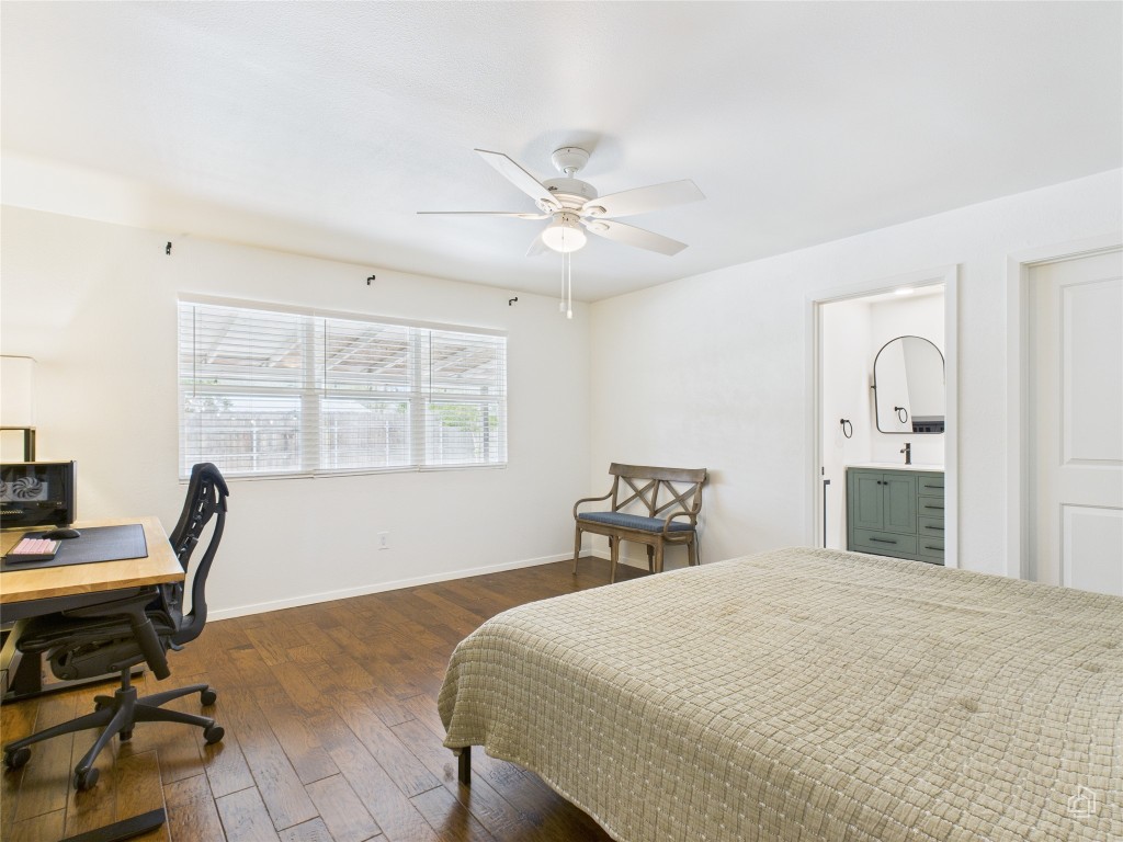 1404 Lance Way Austin, TX 78758 - Photo 17 of 29 a bedroom with a bed and a desk