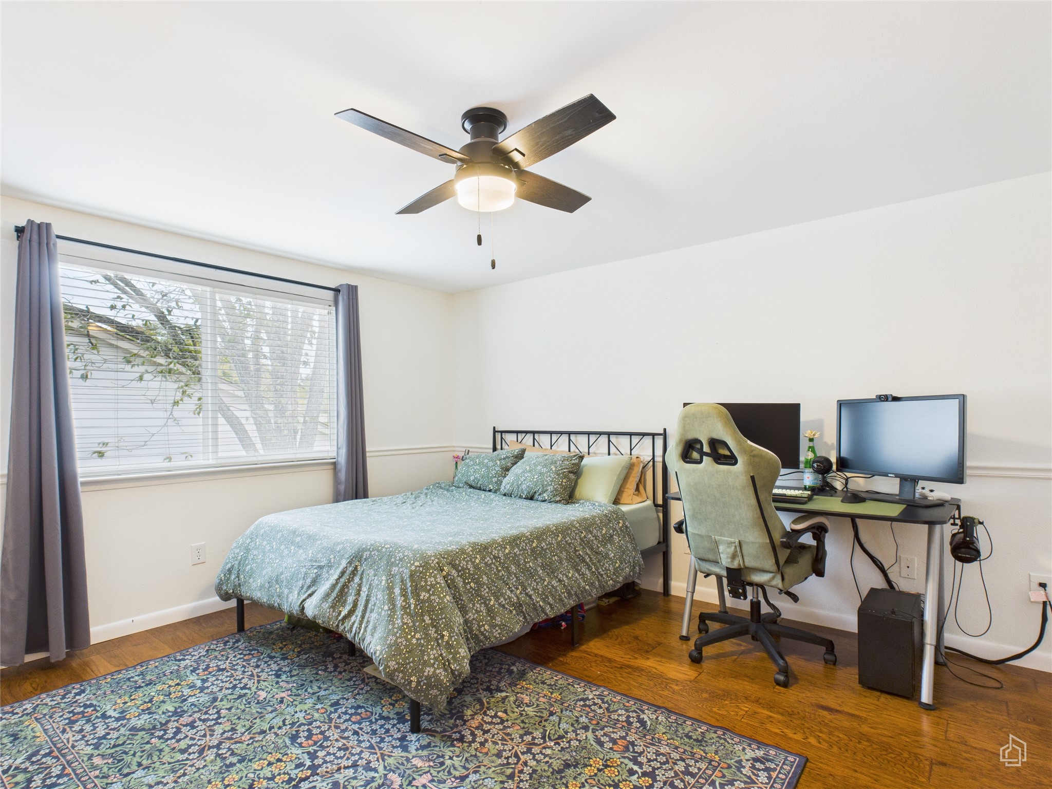 1404 Lance Way Austin, TX 78758 - Photo 20 of 29 a bedroom with a bed and a chandelier