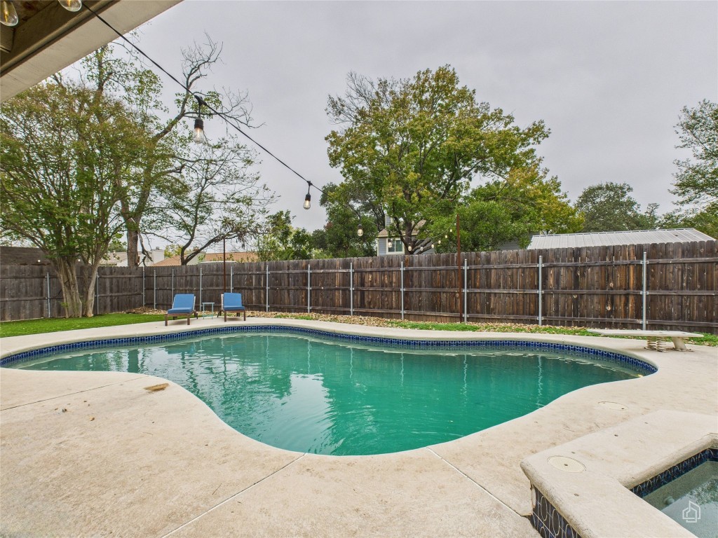 1404 Lance Way Austin, TX 78758 - Photo 2 of 29 a view of a swimming pool and a backyard