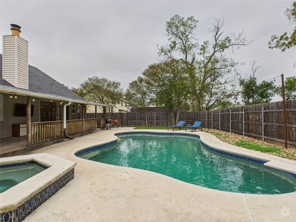 1404 Lance Way Austin, TX 78758 - Photo 22 of 29 a view of a swimming pool with a lounge chair