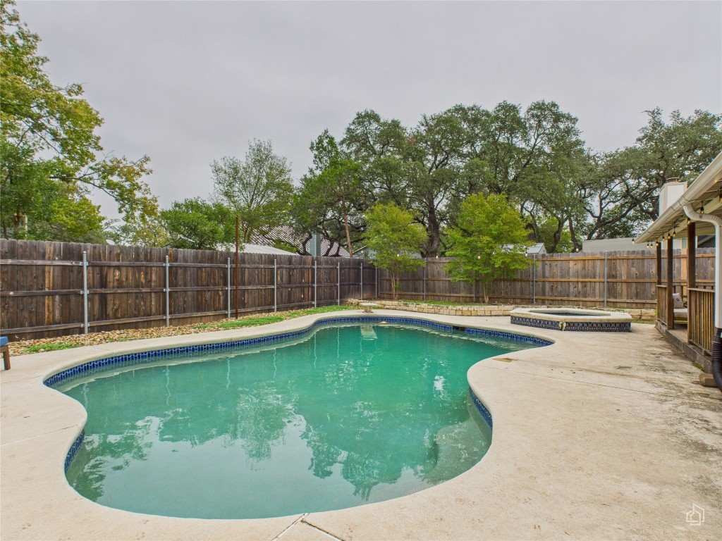 1404 Lance Way Austin, TX 78758 - Photo 23 of 29 a view of a swimming pool with a sitting area