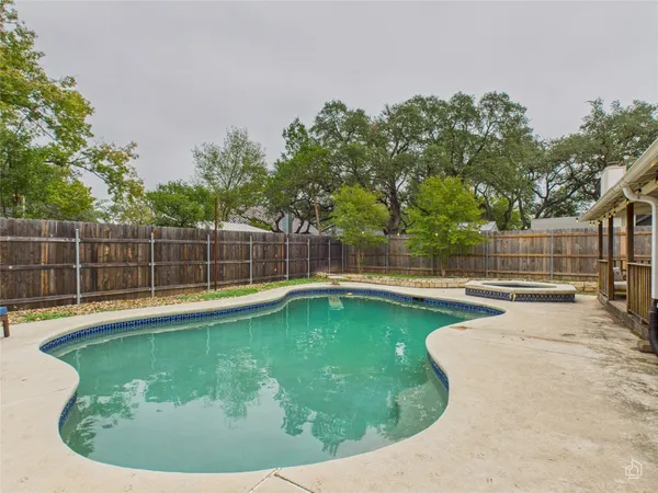 a view of a swimming pool with a sitting area