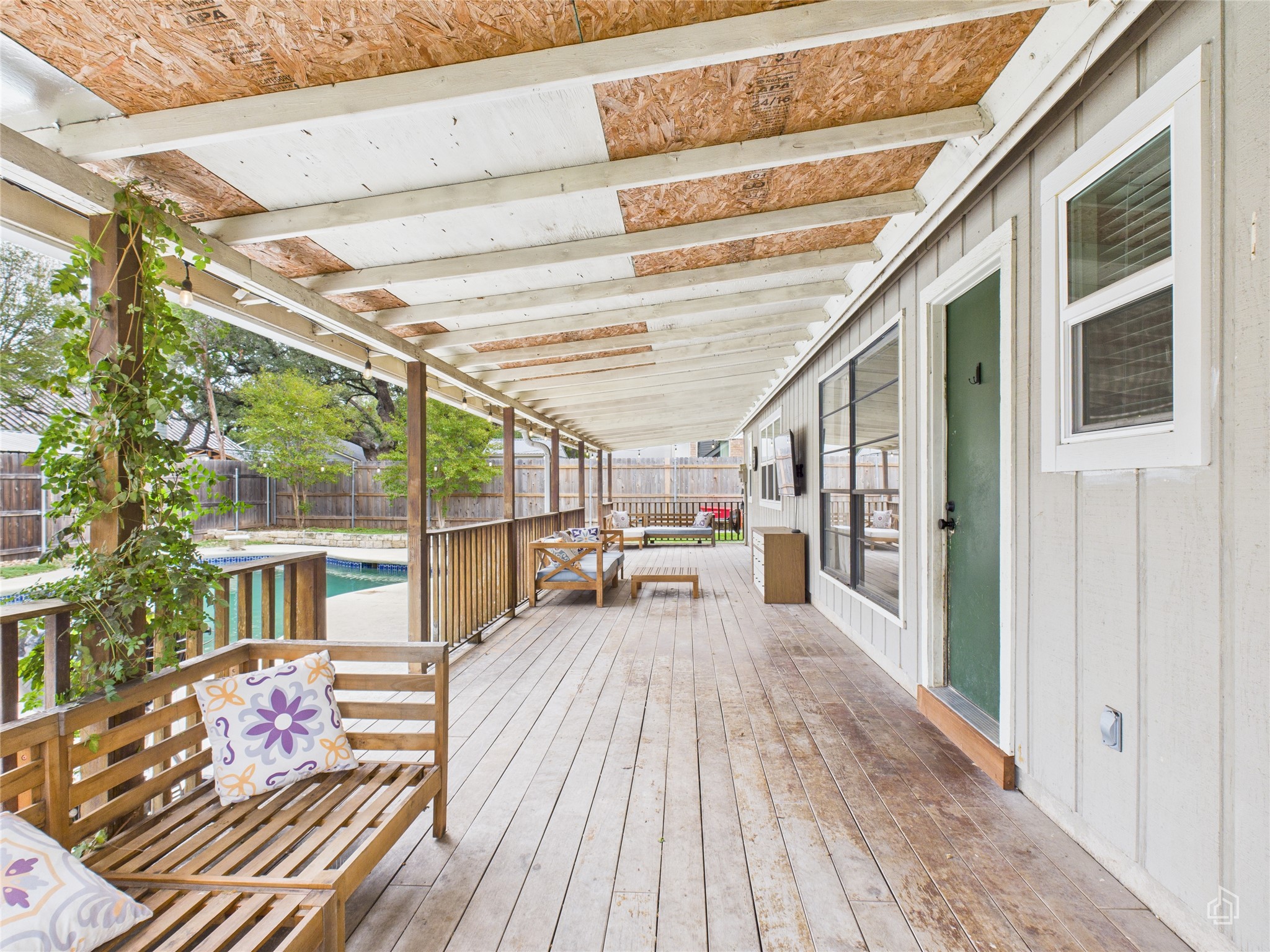 1404 Lance Way Austin, TX 78758 - Photo 26 of 29 a view of a patio with table and chairs and wooden floor