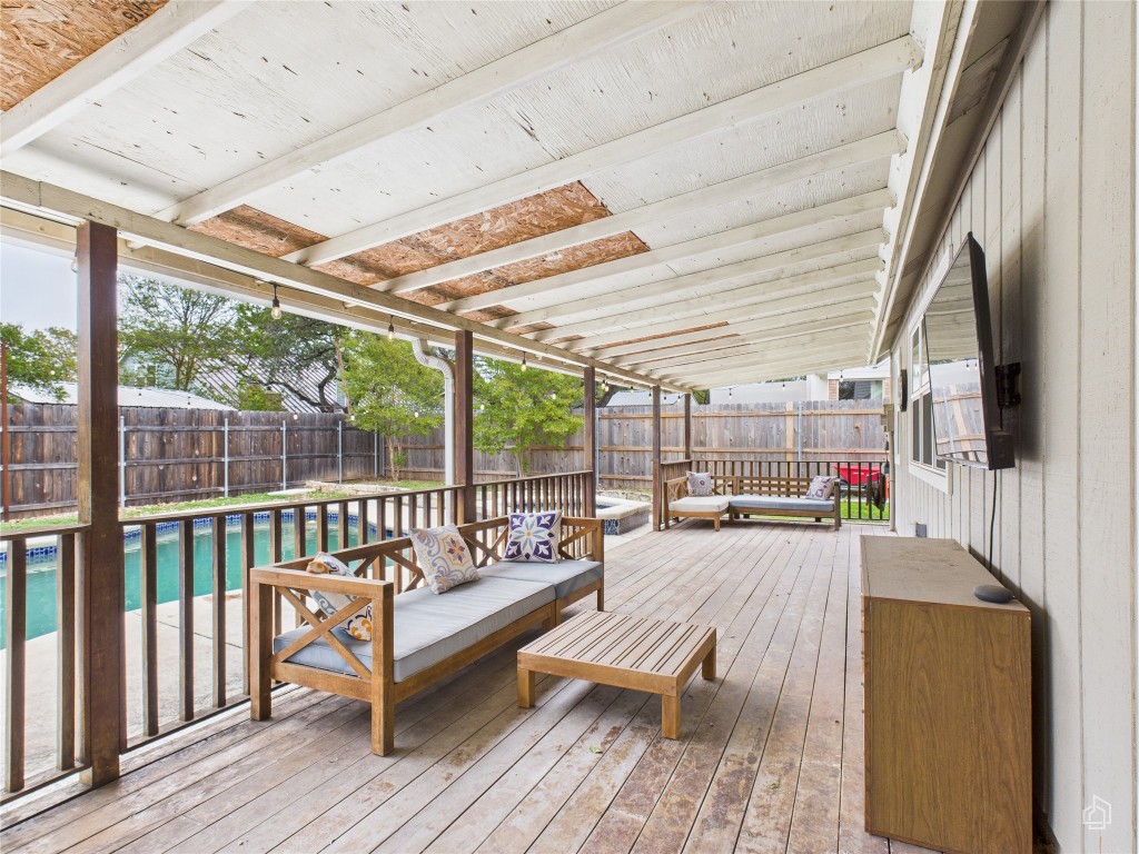 1404 Lance Way Austin, TX 78758 - Photo 27 of 29 a balcony with furniture and a wooden floor