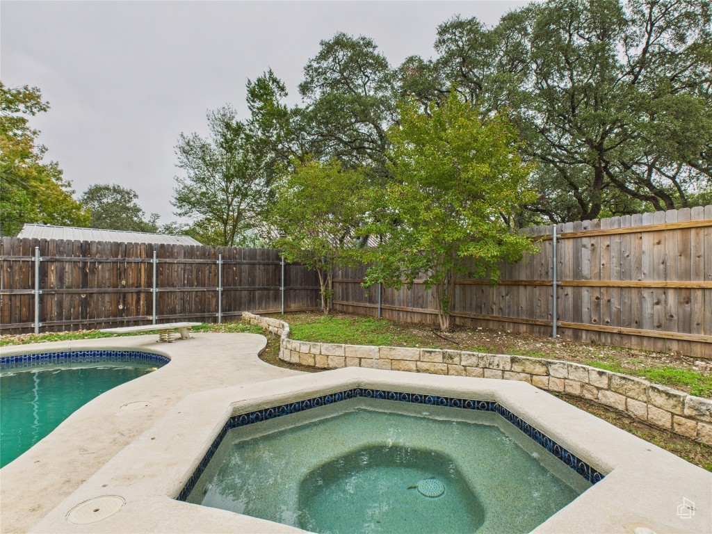 1404 Lance Way Austin, TX 78758 - Photo 28 of 29 a view of a swimming pool with a patio and a yard