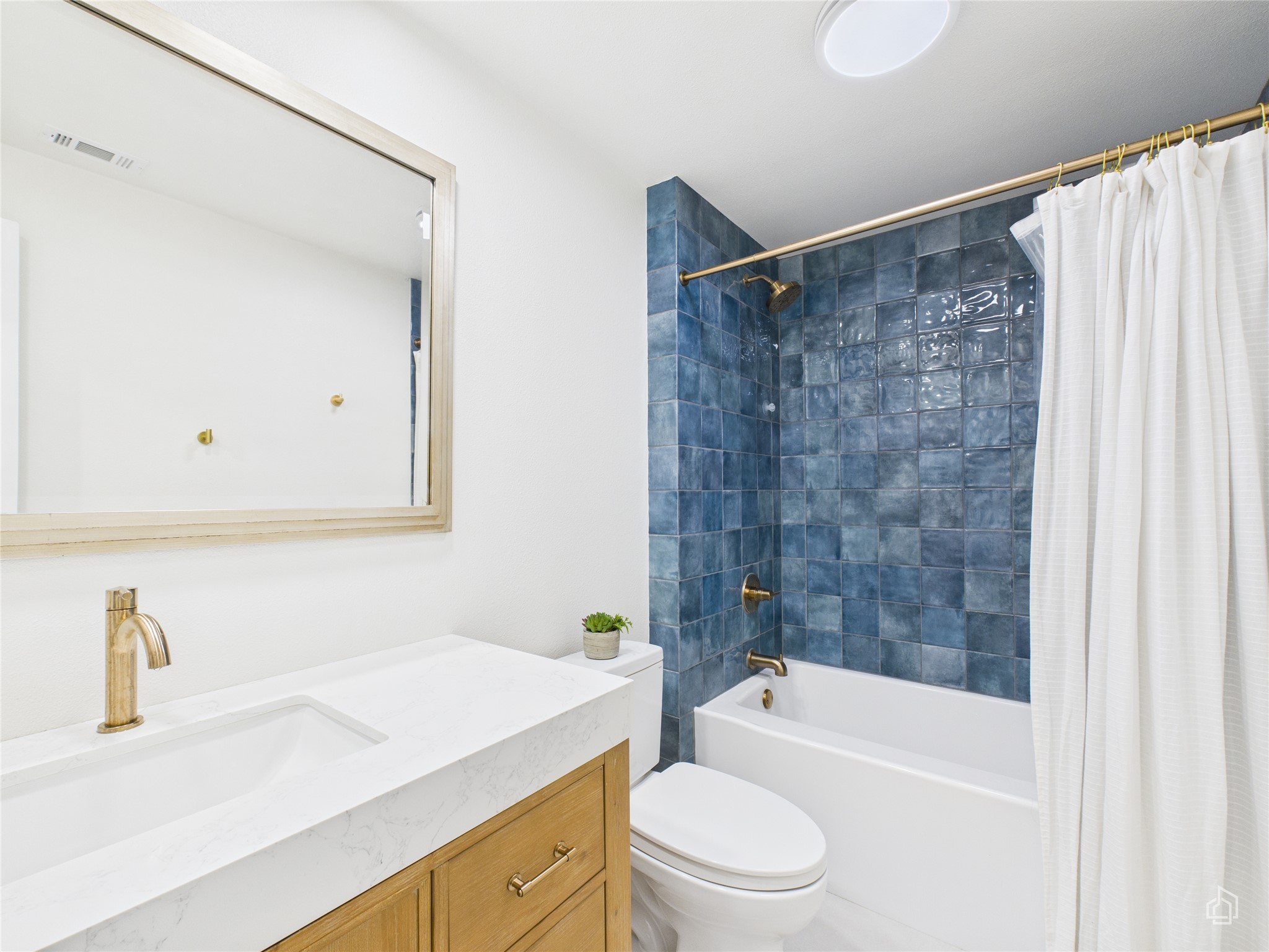 1404 Lance Way Austin, TX 78758 - Photo 5 of 29 a bathroom with a sink toilet and shower