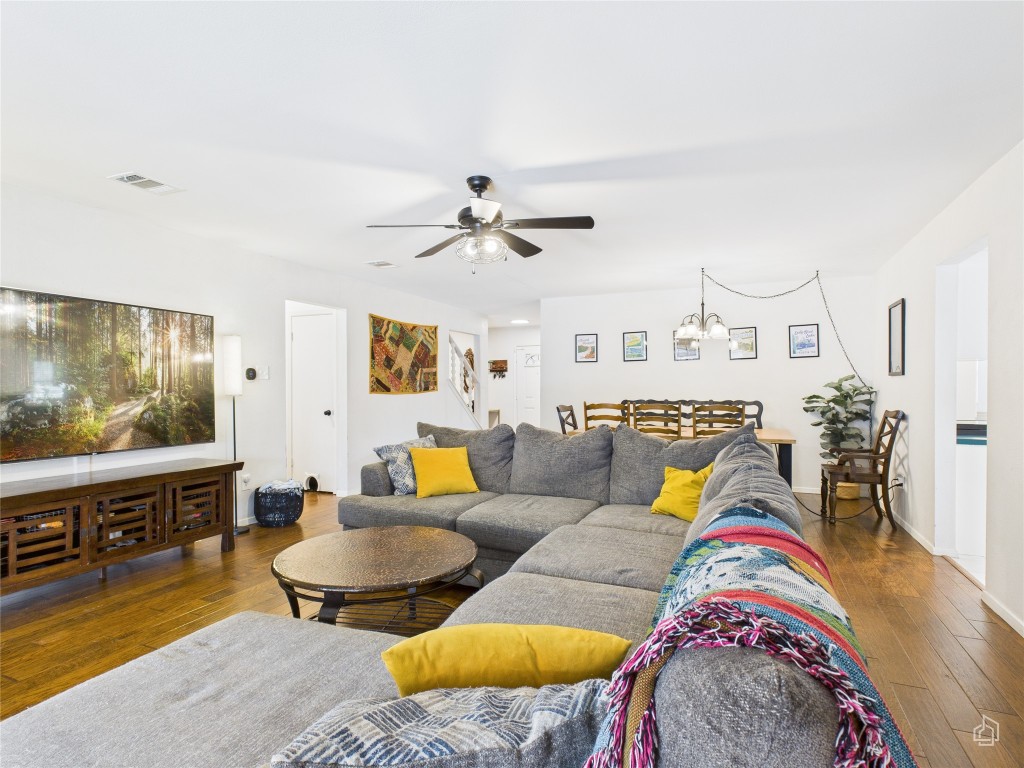 1404 Lance Way Austin, TX 78758 - Photo 6 of 29 a living room with furniture and a flat screen tv
