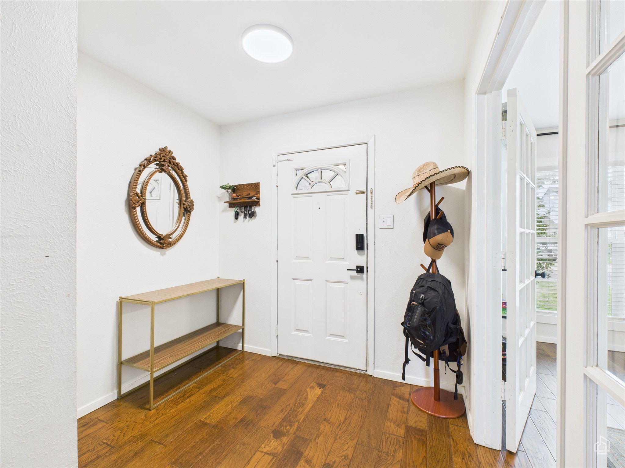 1404 Lance Way Austin, TX 78758 - Photo 9 of 29 a view of a room with wooden floor and white walls
