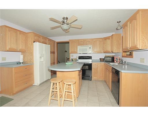 264 Roupe Road Eighty Four, PA 15330 - Photo 5 of 18 Kitchen. Lovely oak cabinetry, tile floor, center island, pantry with slide out shelves, and pass through window to the dining room make this a wonderful kitchen.