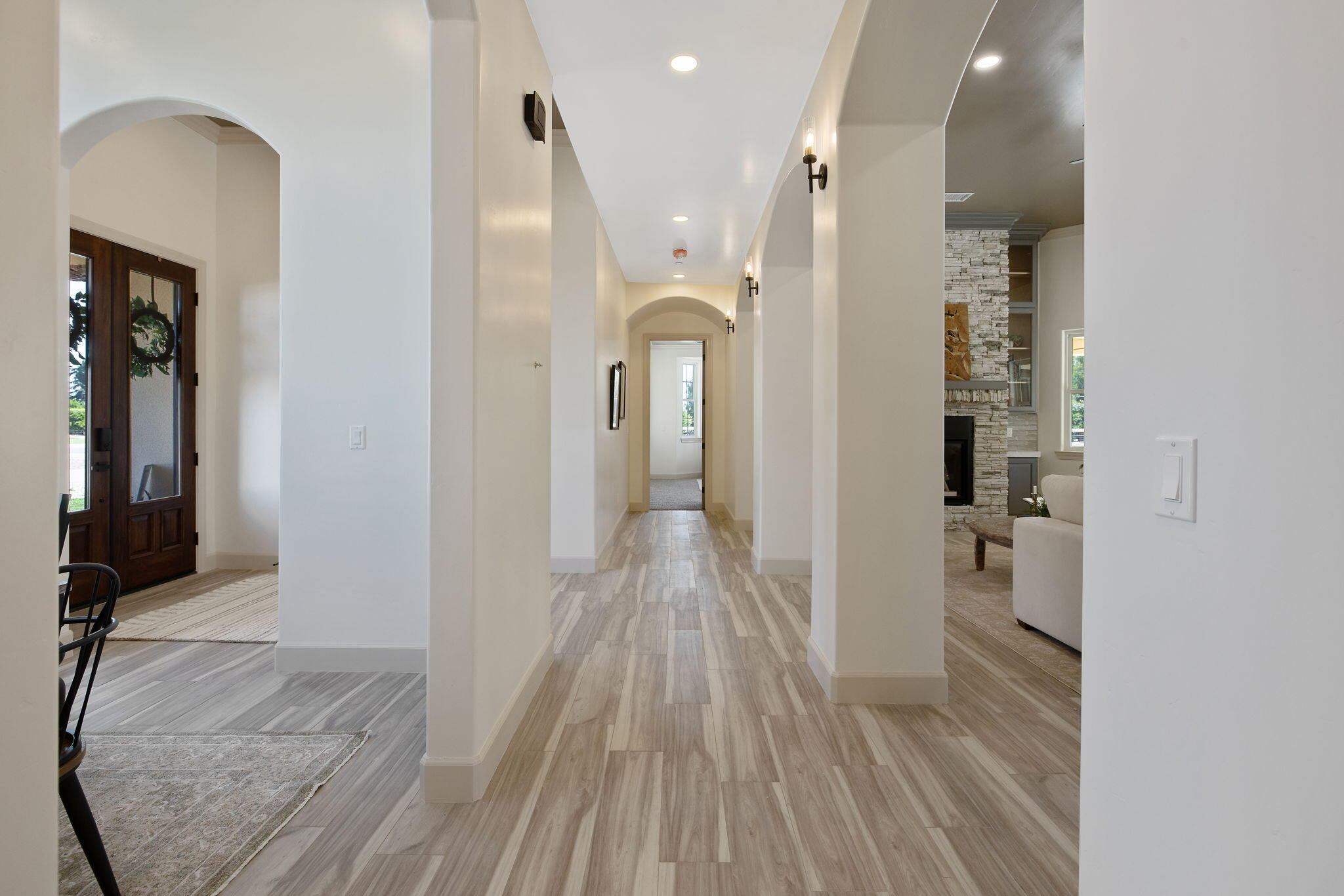 503 East Palm Street Exeter, CA 93221 - Photo 17 of 92 a view of a hallway with wooden floor and staircase