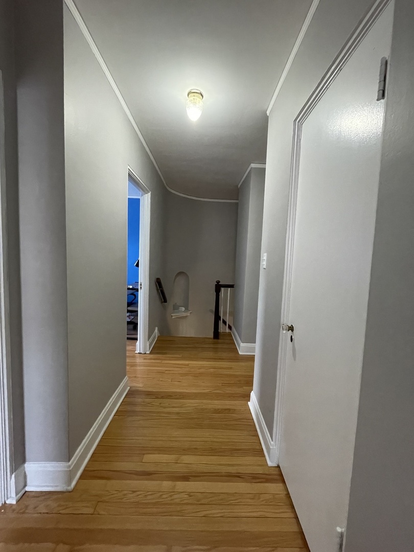 1035 Bonnie Brae River Forest, IL 60305 - Photo 16 of 21 a hallway with wooden floor and closet