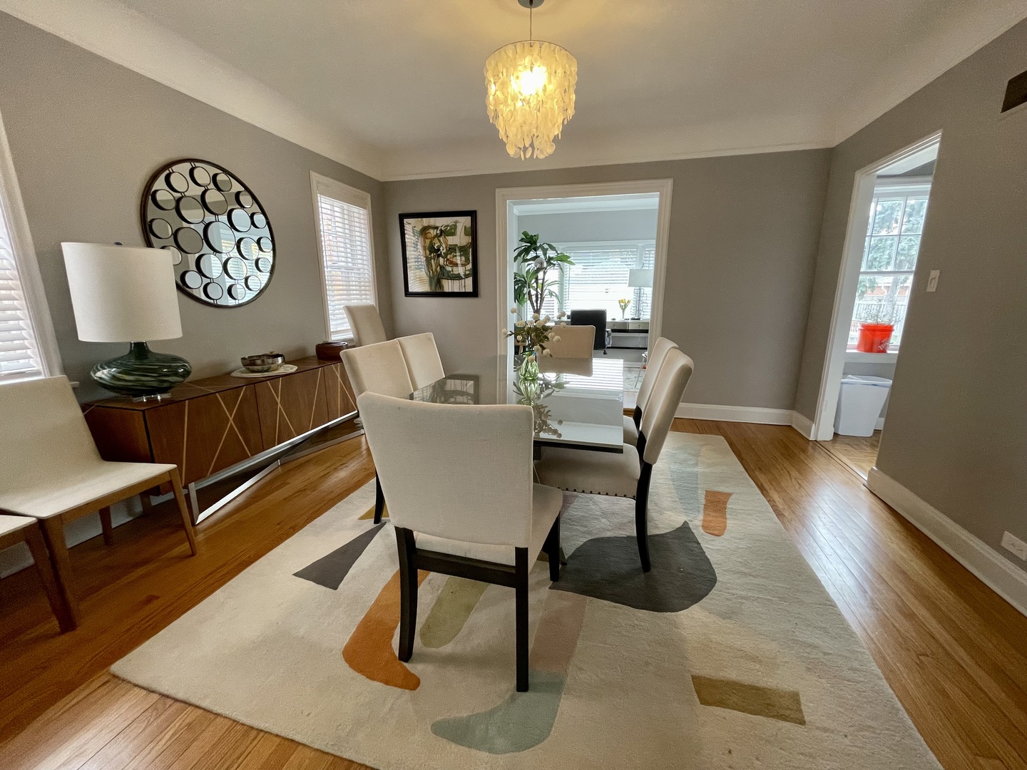 1035 Bonnie Brae River Forest, IL 60305 - Photo 8 of 21 a view of a dining room with furniture a chandelier and wooden floor