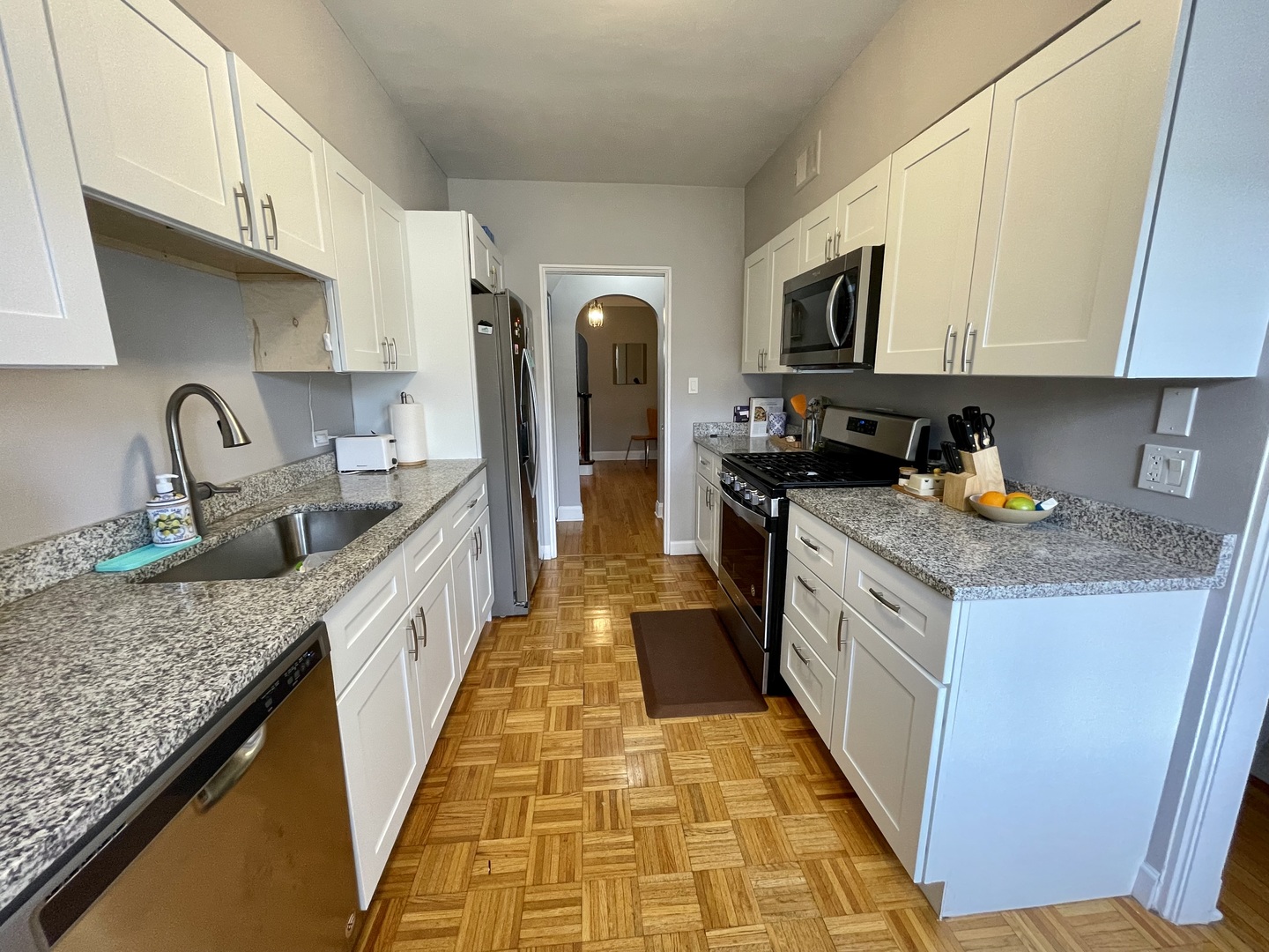 1035 Bonnie Brae River Forest, IL 60305 - Photo 9 of 21 a kitchen with stainless steel appliances granite countertop a sink stove and refrigerator