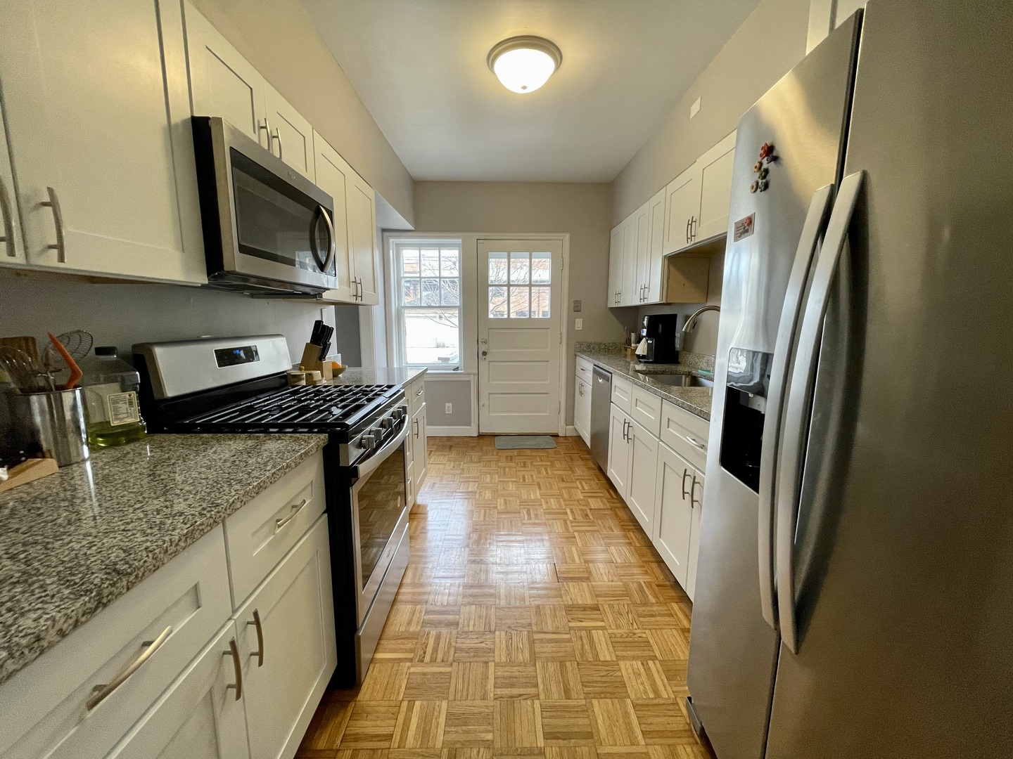 1035 Bonnie Brae River Forest, IL 60305 - Photo 10 of 21 a kitchen with stainless steel appliances granite countertop a refrigerator a stove top oven a sink and dishwasher