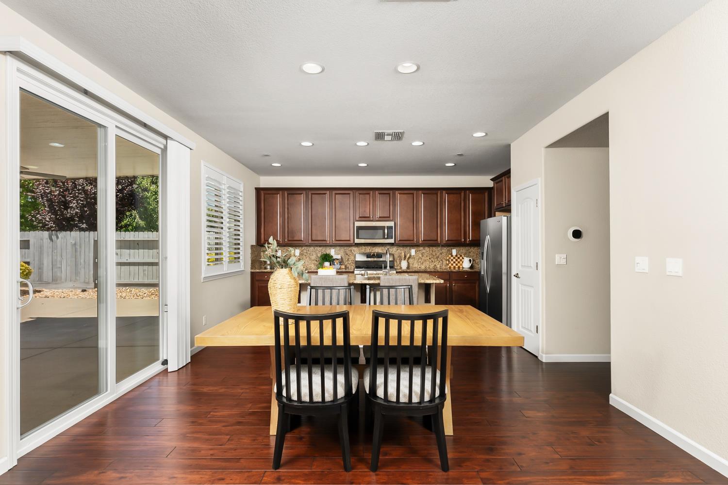 5453 Mossy Stone Way Rancho Cordova, CA 95742 - Photo 23 of 81 a dining room with furniture and wooden floor