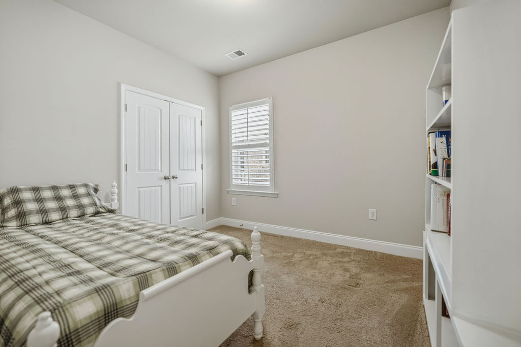 139 Olde Towne Drive Anderson, SC 29621 - Photo 10 of 26 This cozy bedroom features plush carpeting and a bright window, creating a serene and comfortable retreat.