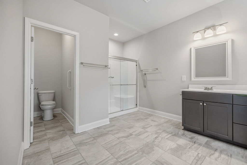 139 Olde Towne Drive Anderson, SC 29621 - Photo 11 of 26 This spacious bathroom offers elegant tile flooring and a functional vanity with ample storage.