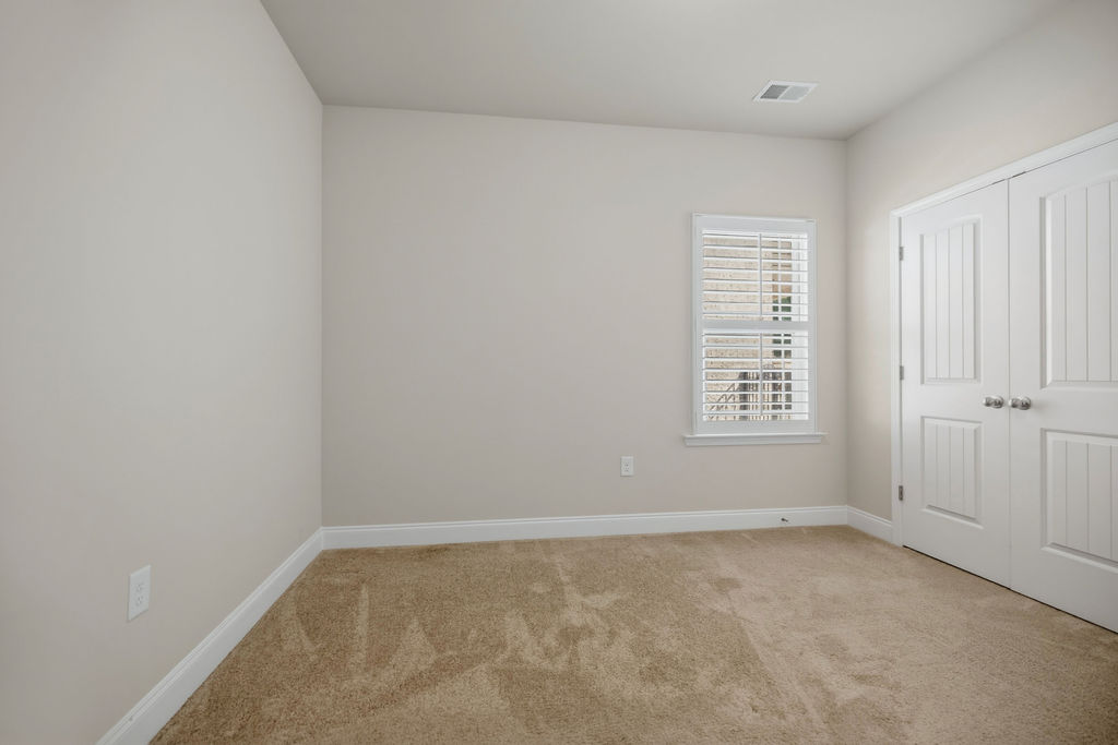 139 Olde Towne Drive Anderson, SC 29621 - Photo 19 of 26 This cozy bedroom features warm carpeting and ample natural light through its window.