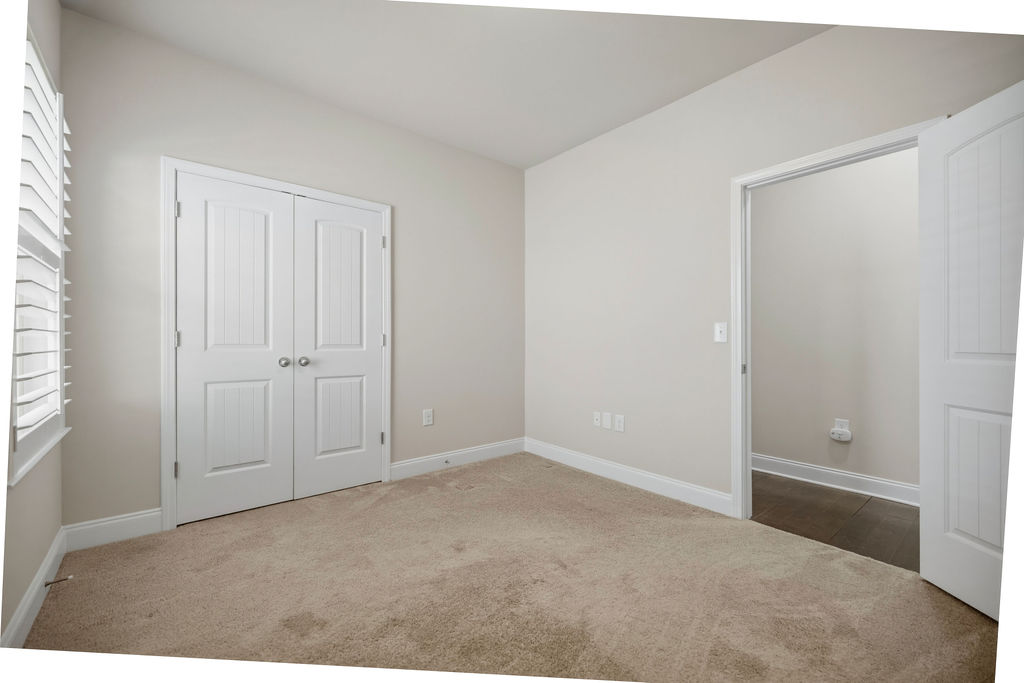 139 Olde Towne Drive Anderson, SC 29621 - Photo 20 of 26 Bright and airy bedroom with plush carpeting and natural light filtering through the window.