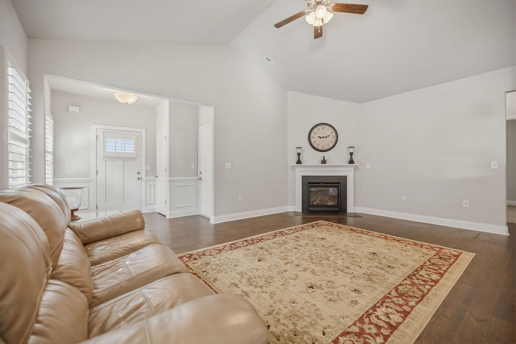 139 Olde Towne Drive Anderson, SC 29621 - Photo 3 of 26 This bright living space features an inviting fireplace and rich hardwood flooring.