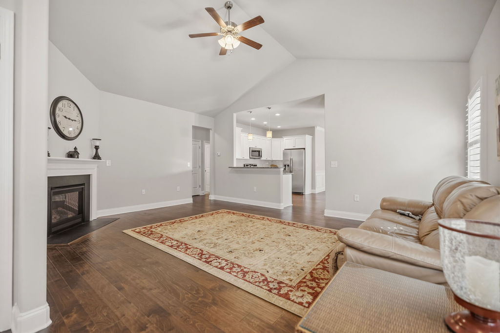 139 Olde Towne Drive Anderson, SC 29621 - Photo 5 of 26 This inviting space features vaulted ceilings and rich hardwood floors, creating an open and welcoming atmosphere.