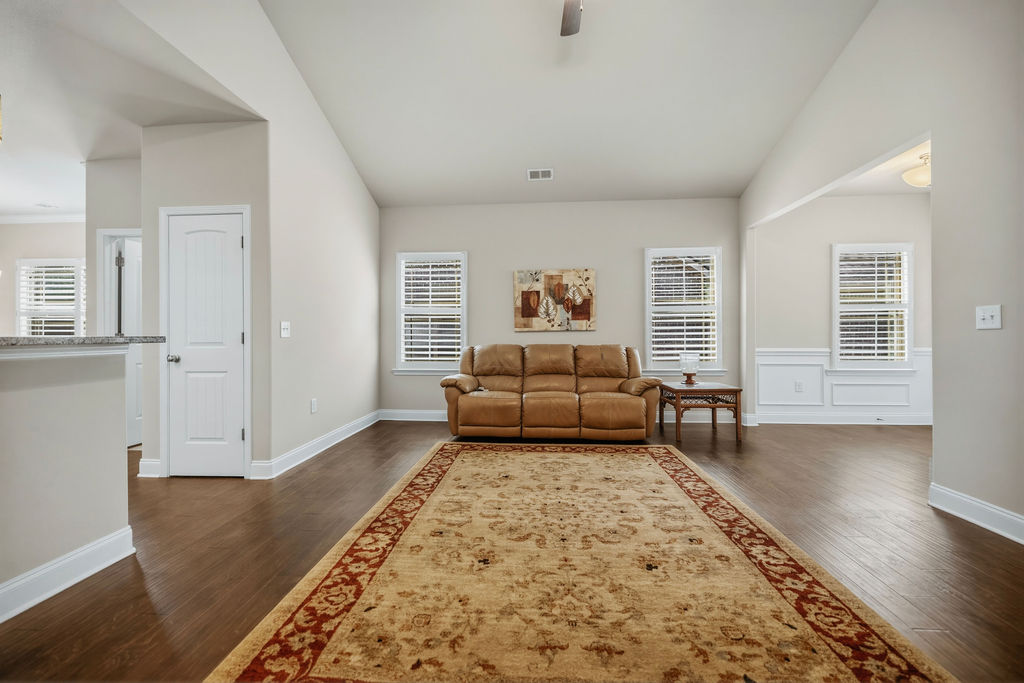 139 Olde Towne Drive Anderson, SC 29621 - Photo 6 of 26 This bright living space features rich hardwood flooring and elegant window treatments, perfect for comfortable living.