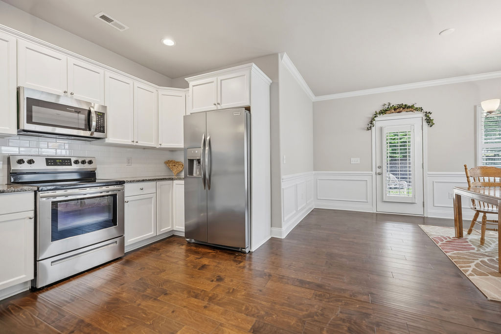 139 Olde Towne Drive Anderson, SC 29621 - Photo 7 of 26 This spacious kitchen offers ample cabinetry, stainless steel appliances, and durable hardwood flooring.