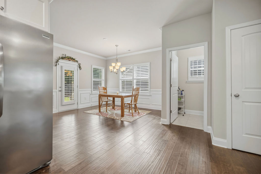 139 Olde Towne Drive Anderson, SC 29621 - Photo 8 of 26 This bright dining area features elegant crown molding and rich hardwood flooring, perfect for daily living.