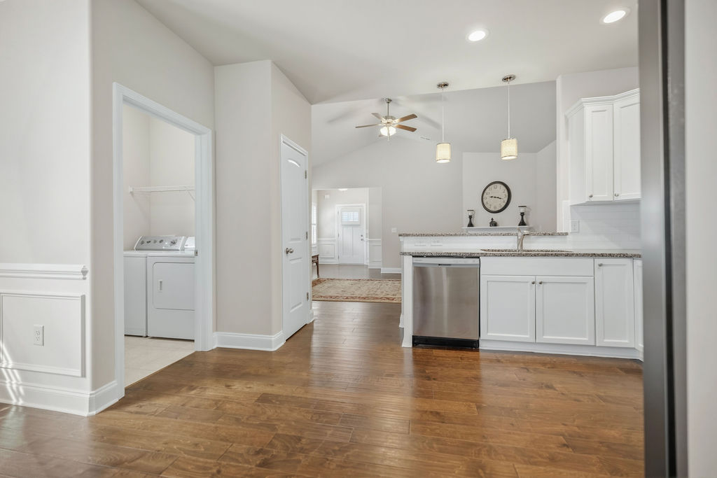 139 Olde Towne Drive Anderson, SC 29621 - Photo 26 of 26 This bright interior features an open floorplan with hardwood flooring and modern kitchen amenities.