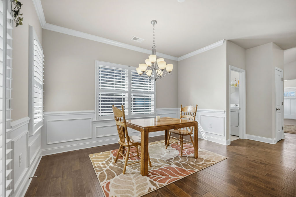 139 Olde Towne Drive Anderson, SC 29621 - Photo 9 of 26 This bright dining area features elegant wainscoting and rich hardwood floors.