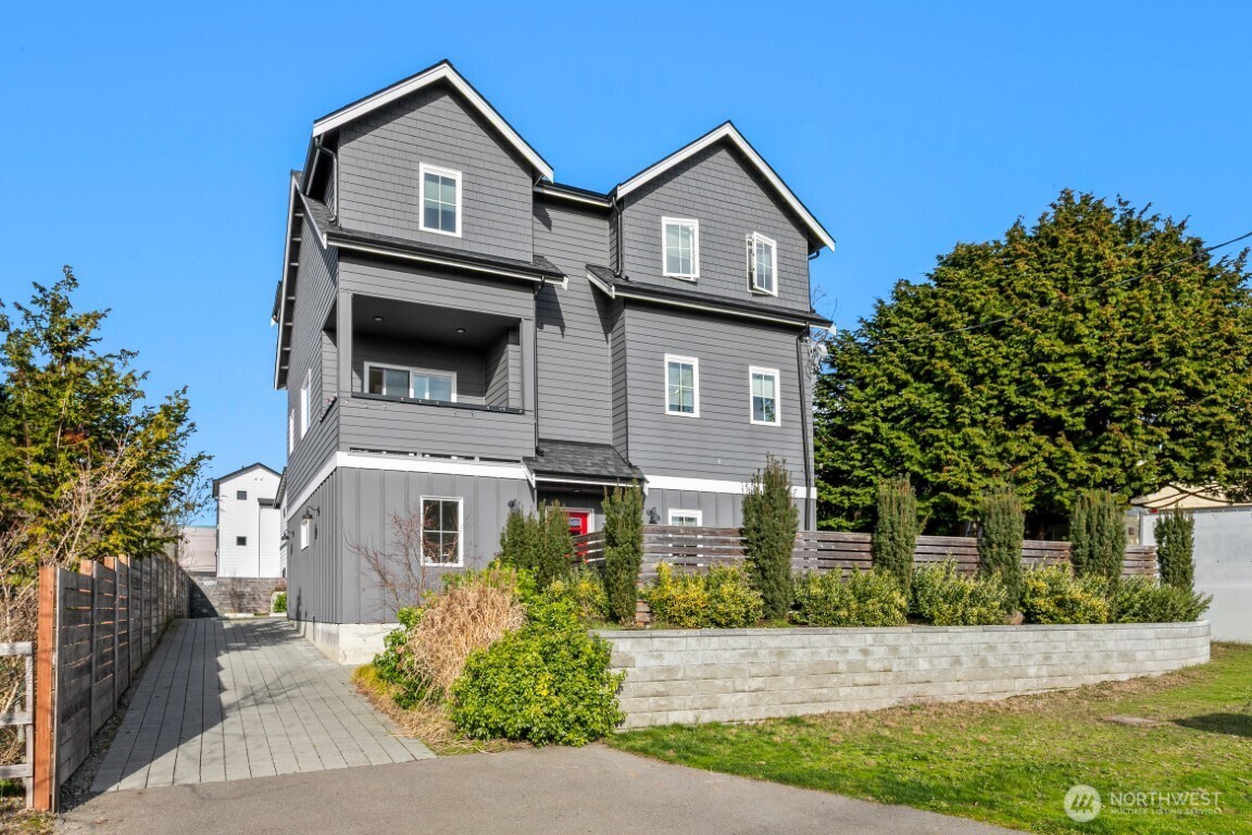 206 North 100th Street, Unit 2 Seattle, WA 98133 - Photo 1 of 1 a front view of a house with a yard
