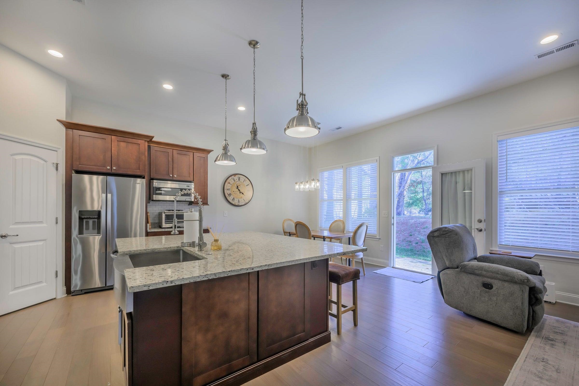 47 Chamberlain Loop Lexington, VA 24450 - Photo 16 of 47 The kitchen boasts a 36” professional stainless steel range, granite countertops, a large center island, and a farmhouse sink.