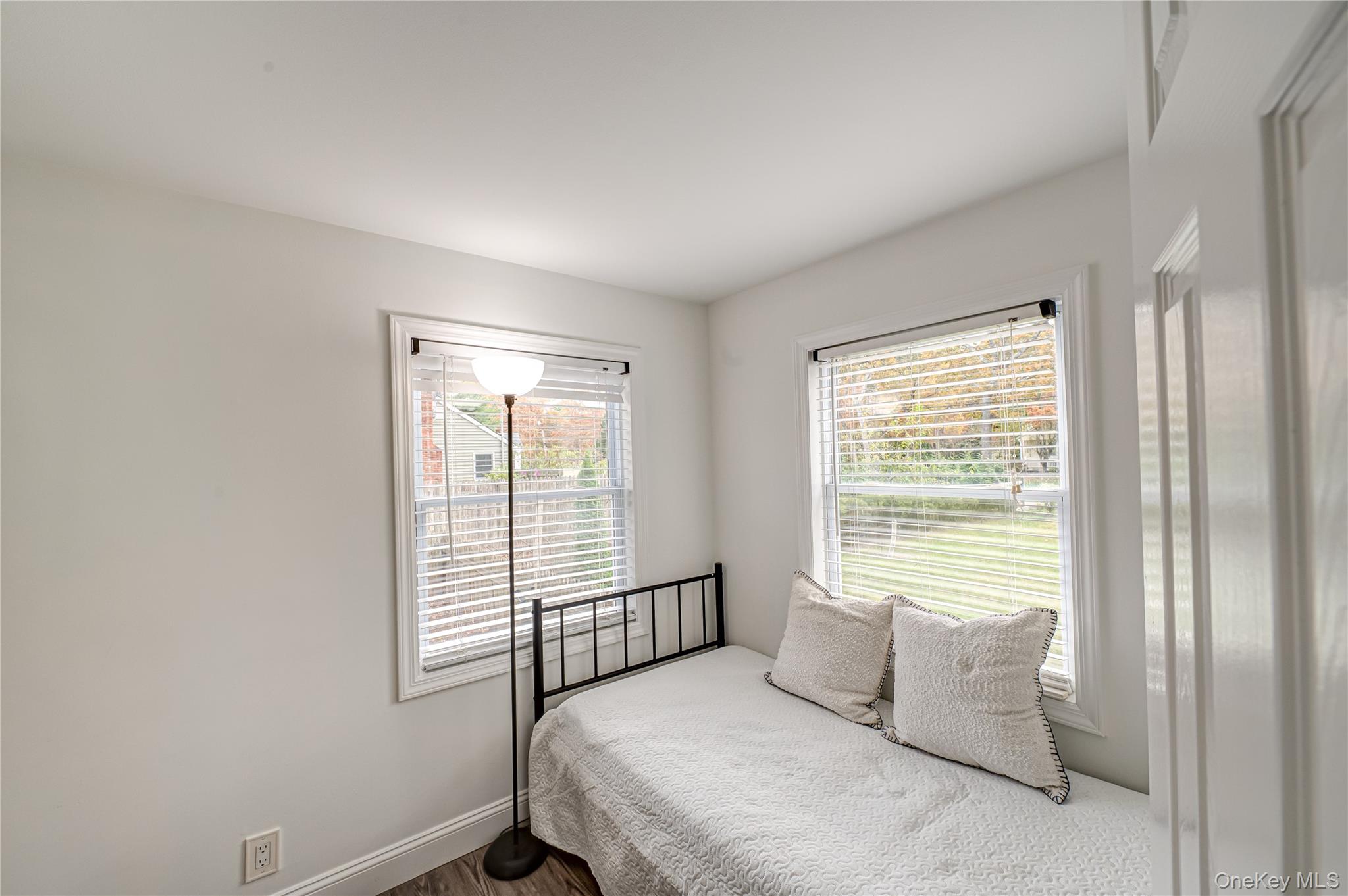 39 Lynncliff Road Hampton Bays, NY 11946 - Photo 14 of 34 Bedroom with wood finished floors and baseboards