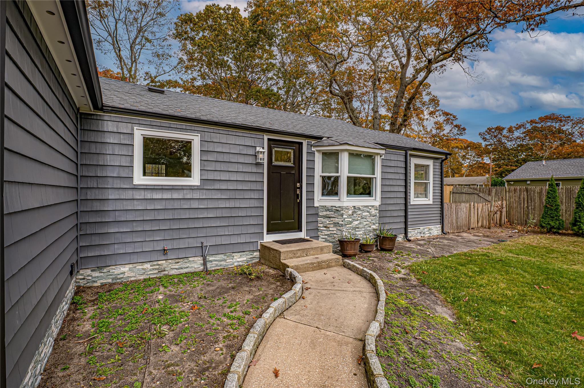 39 Lynncliff Road Hampton Bays, NY 11946 - Photo 25 of 34 Doorway to property with a shingled roof