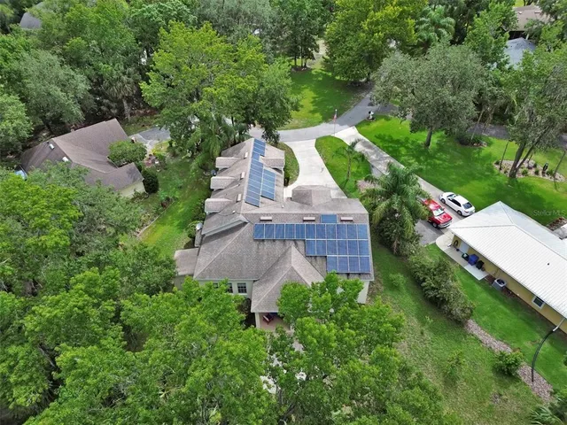an aerial view of a houses with outdoor space and street view