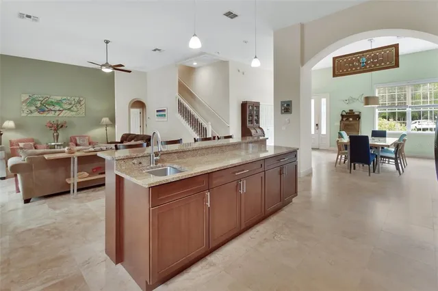 a kitchen with a sink stove and cabinets