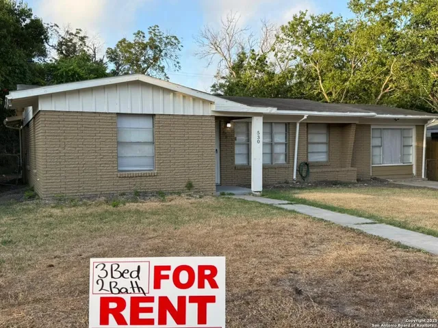 a house with trees in the background